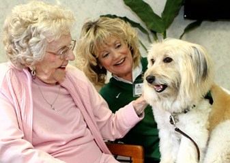 Bailey greets an assisted-living resident